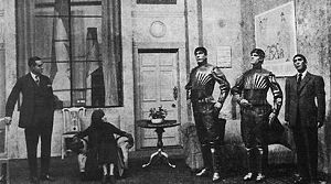 A scene in the play, showing three robots.